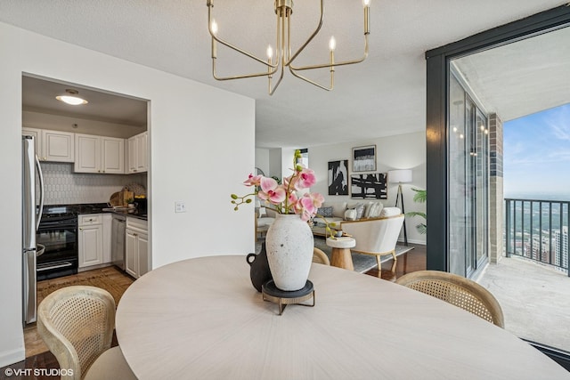 3660 N Lake Shore Dr Unit 4502, Chicago, IL 60613 - dining area featuring a chandelier and floor to ceiling windows