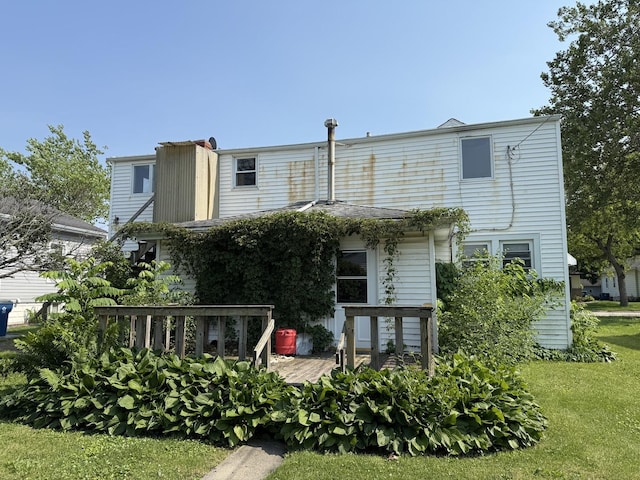 112 W Chippewa St, Dwight, IL 60420 - rear view of property featuring a lawn