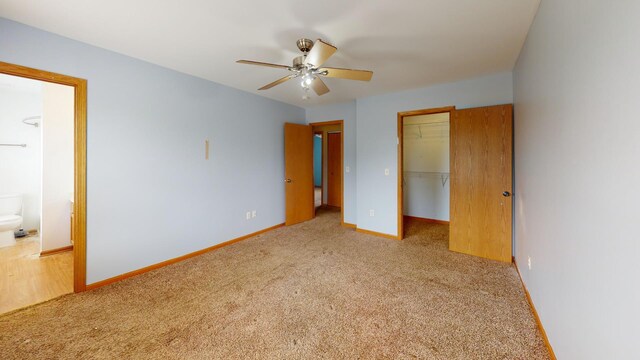 256 Stamford Ln, Romeoville, IL 60446 - unfurnished bedroom featuring carpet, a walk in closet, a closet, and connected bathroom