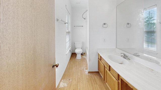 256 Stamford Ln, Romeoville, IL 60446 - bathroom featuring vanity, wood finished floors, and healthy amount of natural light