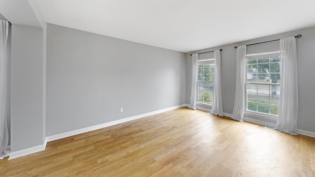 256 Stamford Ln, Romeoville, IL 60446 - spare room featuring light wood-style floors and baseboards