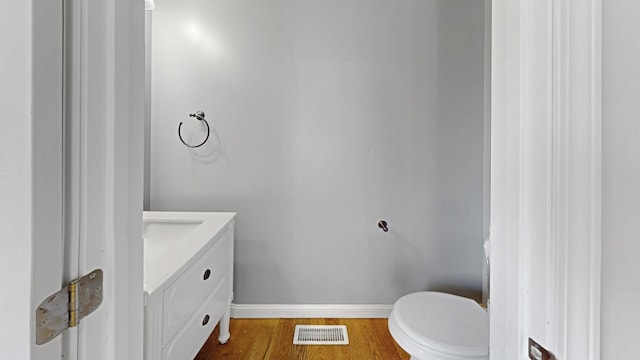 256 Stamford Ln, Romeoville, IL 60446 - half bath featuring vanity and wood finished floors