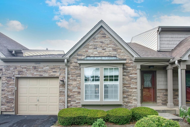 1288 Seabury Cir, Carol Stream, IL 60188 - view of home's exterior featuring stone siding, roof with shingles, and driveway
