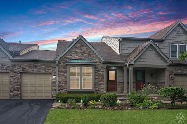 1288 Seabury Cir, Carol Stream, IL 60188 - craftsman-style home featuring roof with shingles, a yard, driveway, and stone siding