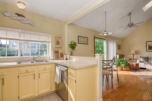 1288 Seabury Cir, Carol Stream, IL 60188 - kitchen featuring stainless steel dishwasher, a peninsula, open floor plan, light countertops, and lofted ceiling