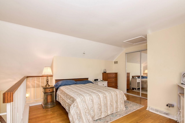 1288 Seabury Cir, Carol Stream, IL 60188 - bedroom featuring wood finished floors, attic access, a closet, and lofted ceiling