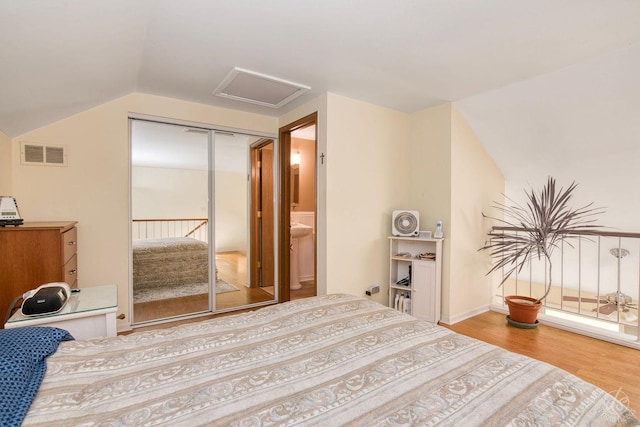 1288 Seabury Cir, Carol Stream, IL 60188 - bedroom featuring attic access, wood finished floors, lofted ceiling, and a closet