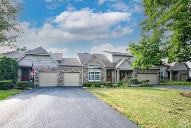 1288 Seabury Cir, Carol Stream, IL 60188 - craftsman house featuring stone siding, asphalt driveway, a front yard, and a garage