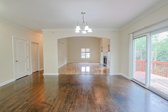200 Ahmed Ct, Glendale Heights, IL 60139 - unfurnished living room with arched walkways, wood finished floors, a chandelier, ornamental molding, and a fireplace with flush hearth