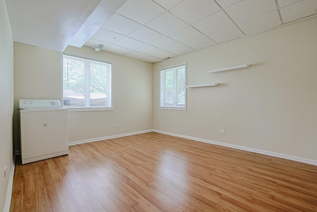 200 Ahmed Ct, Glendale Heights, IL 60139 - unfurnished room featuring washer / dryer, a paneled ceiling, and light wood-style floors