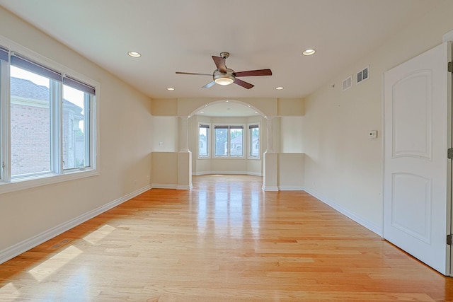 200 Ahmed Ct, Glendale Heights, IL 60139 - spare room with arched walkways, light wood finished floors, ceiling fan, and recessed lighting