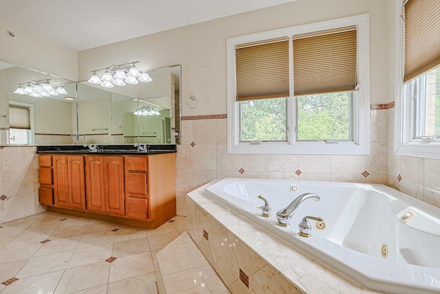 200 Ahmed Ct, Glendale Heights, IL 60139 - full bathroom featuring double vanity, tile walls, a whirlpool tub, and a wainscoted wall