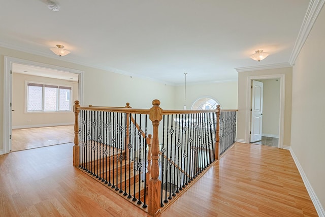 200 Ahmed Ct, Glendale Heights, IL 60139 - hall featuring plenty of natural light, light wood-style floors, an upstairs landing, and crown molding