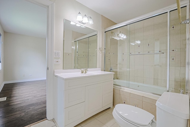 200 Ahmed Ct, Glendale Heights, IL 60139 - bathroom featuring tiled shower / bath combo, vanity, and wood finished floors