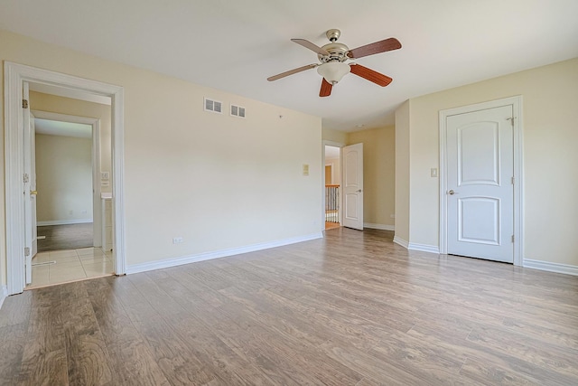 200 Ahmed Ct, Glendale Heights, IL 60139 - unfurnished bedroom with light wood-type flooring, ensuite bath, and ceiling fan