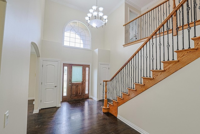 200 Ahmed Ct, Glendale Heights, IL 60139 - foyer with arched walkways, wood finished floors, a chandelier, ornamental molding, and a towering ceiling