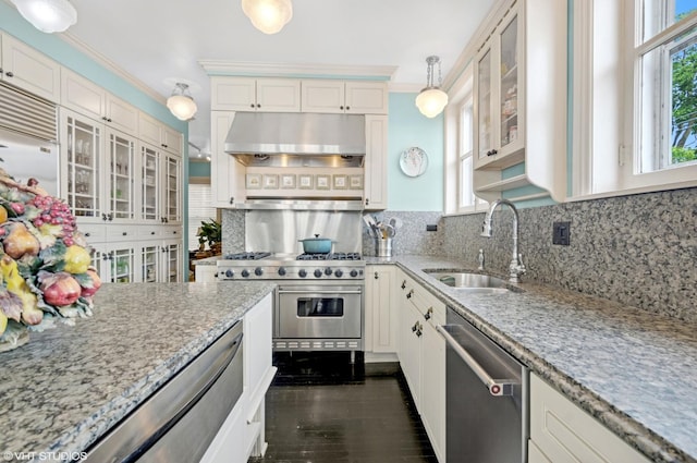 1116 W N Shore Ave Unit 2, Chicago, IL 60626 - kitchen with appliances with stainless steel finishes, under cabinet range hood, backsplash, light stone countertops, and ornamental molding