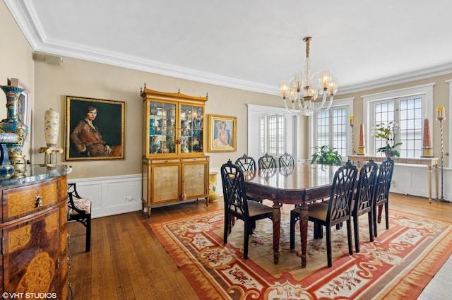 1116 W N Shore Ave Unit 2, Chicago, IL 60626 - dining room with a chandelier, ornamental molding, wood finished floors, and a wainscoted wall