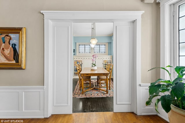 1116 W N Shore Ave Unit 2, Chicago, IL 60626 - dining space featuring a decorative wall, a wainscoted wall, and wood finished floors