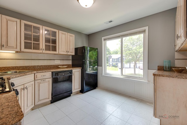 923 Manchester Cir Unit 923, Schaumburg, IL 60193 - kitchen featuring black appliances, wainscoting, glass insert cabinets, cream cabinetry, and light tile patterned flooring