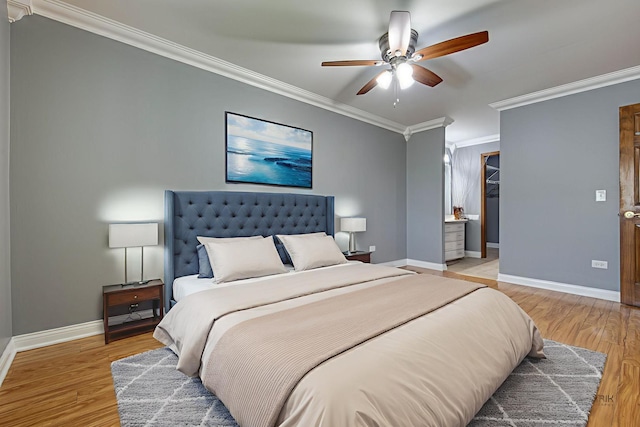 923 Manchester Cir Unit 923, Schaumburg, IL 60193 - bedroom featuring ornamental molding, light wood-style flooring, ceiling fan, a spacious closet, and a closet