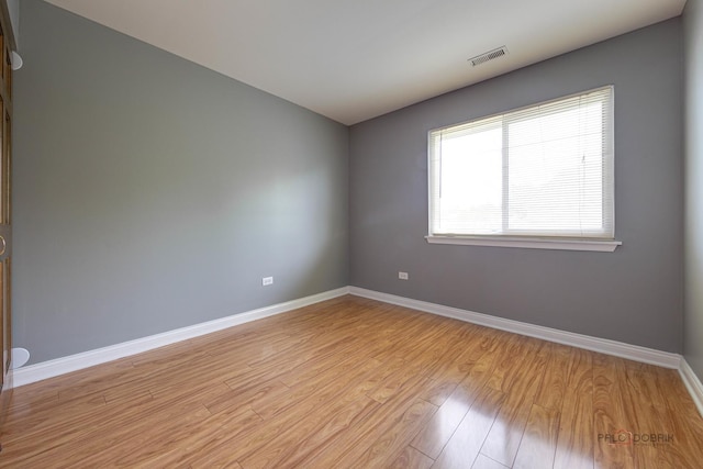 923 Manchester Cir Unit 923, Schaumburg, IL 60193 - unfurnished room with baseboards and light wood-type flooring