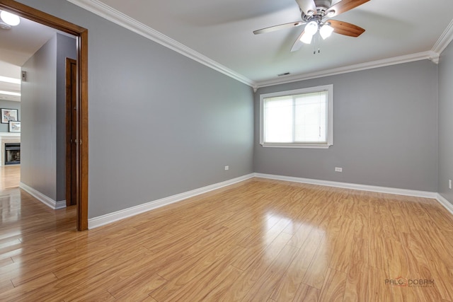923 Manchester Cir Unit 923, Schaumburg, IL 60193 - empty room with ceiling fan, crown molding, and light wood-style flooring