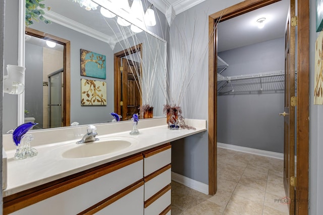 923 Manchester Cir Unit 923, Schaumburg, IL 60193 - bathroom featuring crown molding, vanity, a walk in closet, a shower stall, and tile patterned flooring