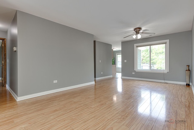 923 Manchester Cir Unit 923, Schaumburg, IL 60193 - empty room with ceiling fan and light wood-type flooring