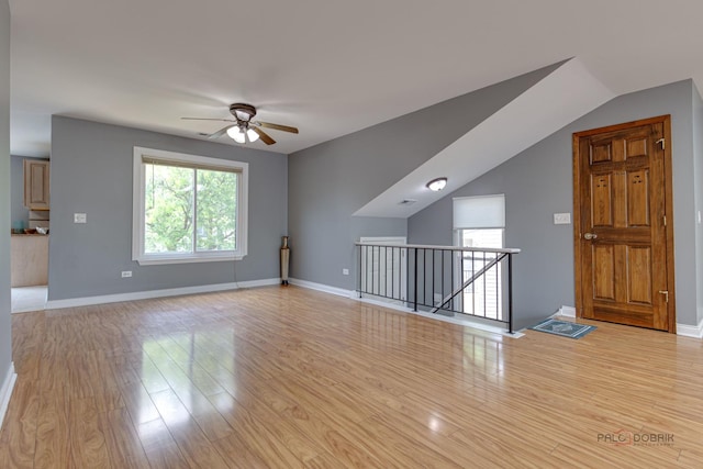 923 Manchester Cir Unit 923, Schaumburg, IL 60193 - unfurnished living room featuring a ceiling fan and light wood-type flooring