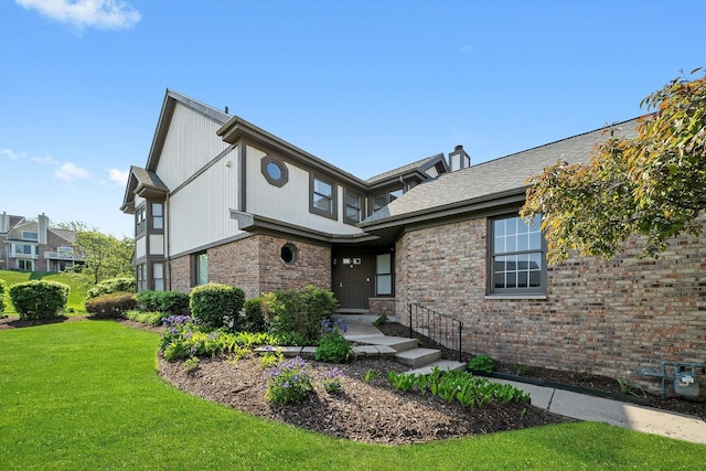 14449 Golf Rd, Orland Park, IL 60462 - view of front of house featuring a front yard and brick siding