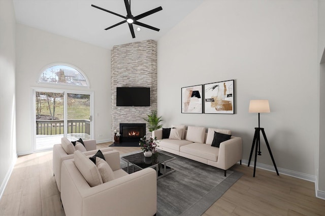 14449 Golf Rd, Orland Park, IL 60462 - living room with high vaulted ceiling, a ceiling fan, wood finished floors, and a fireplace