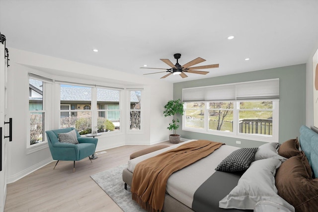 14449 Golf Rd, Orland Park, IL 60462 - bedroom featuring multiple windows, light wood finished floors, recessed lighting, a barn door, and ceiling fan