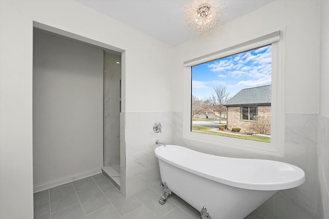 14449 Golf Rd, Orland Park, IL 60462 - full bathroom featuring tile walls, a freestanding tub, tile patterned floors, wainscoting, and a chandelier