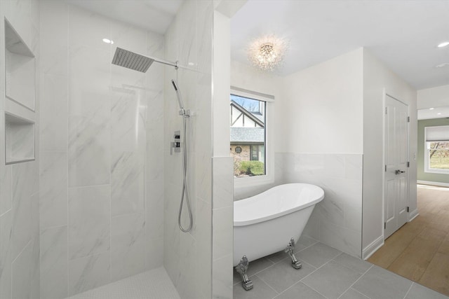 14449 Golf Rd, Orland Park, IL 60462 - bathroom featuring tile walls, a freestanding tub, a tile shower, tile patterned floors, and recessed lighting
