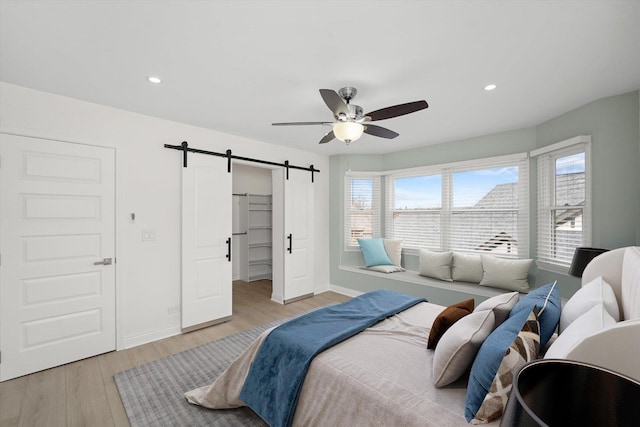 14449 Golf Rd, Orland Park, IL 60462 - bedroom featuring a barn door, light wood-style flooring, multiple windows, recessed lighting, and a ceiling fan