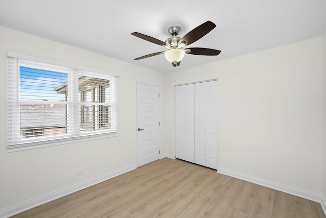 14449 Golf Rd, Orland Park, IL 60462 - unfurnished bedroom featuring light wood-style flooring, a closet, and a ceiling fan