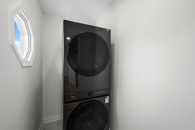14449 Golf Rd, Orland Park, IL 60462 - laundry area with stacked washer and clothes dryer and baseboards