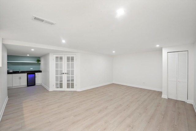 14449 Golf Rd, Orland Park, IL 60462 - unfurnished living room featuring french doors, recessed lighting, light wood-style floors, and bar