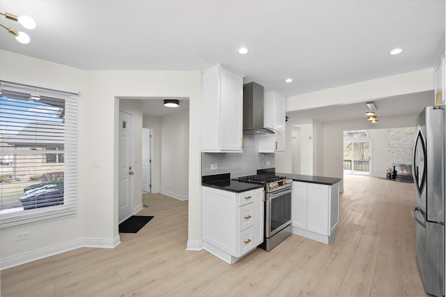 14449 Golf Rd, Orland Park, IL 60462 - kitchen featuring appliances with stainless steel finishes, wall chimney exhaust hood, dark countertops, white cabinets, and light wood finished floors