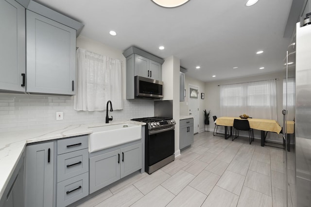 3043 W 96th Pl, Evergreen Park, IL 60805 - kitchen featuring appliances with stainless steel finishes, gray cabinetry, tasteful backsplash, light stone counters, and recessed lighting