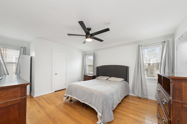 3043 W 96th Pl, Evergreen Park, IL 60805 - bedroom featuring light wood-style flooring, multiple windows, and a ceiling fan