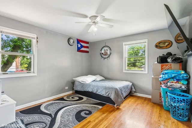 852 Pamela Dr, Bensenville, IL 60106 - bedroom featuring multiple windows, wood finished floors, and ceiling fan