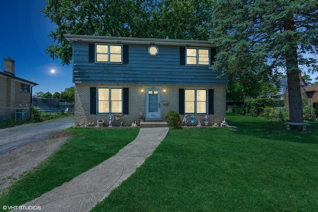 852 Pamela Dr, Bensenville, IL 60106 - colonial-style house with brick siding