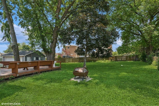 852 Pamela Dr, Bensenville, IL 60106 - fenced backyard with an outdoor fire pit and a wooden deck
