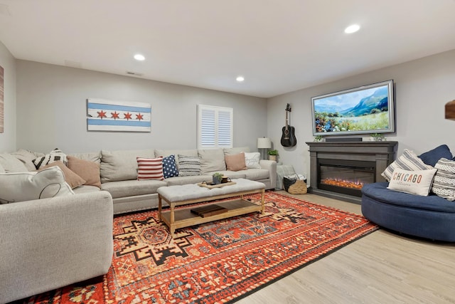 661 Regal Ln, Algonquin, IL 60102 - living room featuring a fireplace with flush hearth, recessed lighting, and wood finished floors