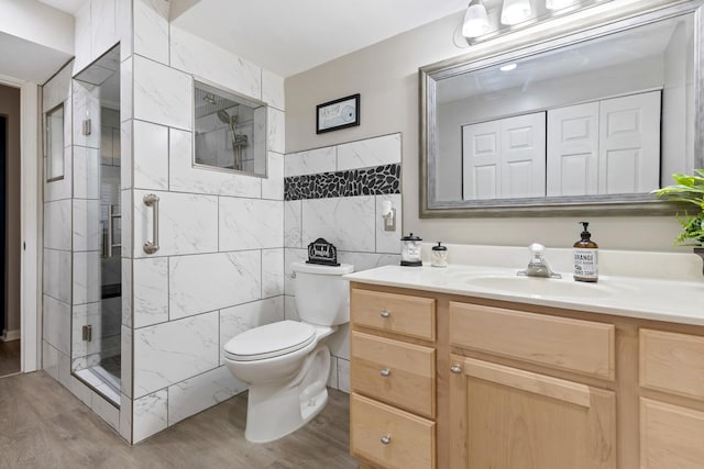 661 Regal Ln, Algonquin, IL 60102 - full bathroom featuring vanity, wood finished floors, a shower stall, and tile walls
