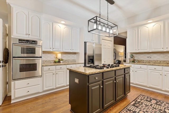 661 Regal Ln, Algonquin, IL 60102 - kitchen with appliances with stainless steel finishes, white cabinets, light wood-type flooring, and recessed lighting