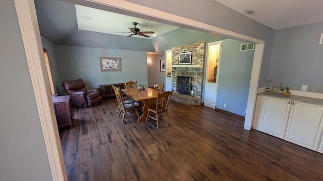 5N119 Mary Ct, Saint Charles, IL 60175 - dining area featuring dark wood-style flooring, a large fireplace, a ceiling fan, and vaulted ceiling