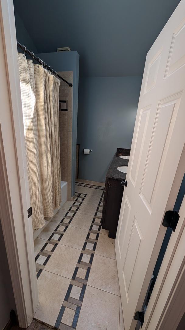 5N119 Mary Ct, Saint Charles, IL 60175 - bathroom featuring vanity, tile patterned flooring, and shower / bath combo
